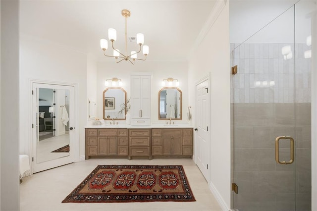 305 Carmel Valley Way, Edmond, OK 73025 - bathroom with ornamental molding, double vanity, a chandelier, and a stall shower