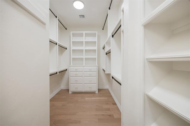305 Carmel Valley Way, Edmond, OK 73025 - spacious closet with light wood-type flooring