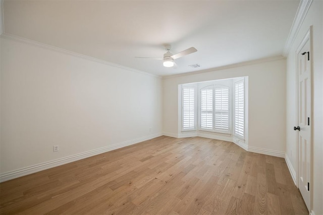 305 Carmel Valley Way, Edmond, OK 73025 - unfurnished room with light wood-style flooring, a ceiling fan, and crown molding