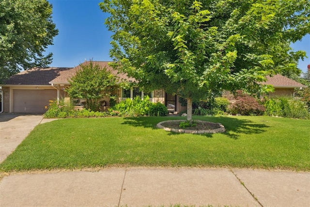 4424 Brighton Ct, Norman, OK 73072 - view of property hidden behind natural elements with driveway, a front lawn, and a garage