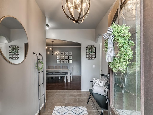7821 Lindsay Ln, Edmond, OK 73025 - tiled entrance foyer with a chandelier and arched walkways