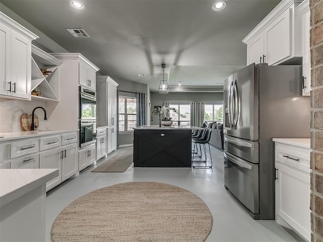 7821 Lindsay Ln, Edmond, OK 73025 - kitchen featuring stainless steel appliances, open shelves, finished concrete flooring, recessed lighting, and white cabinets