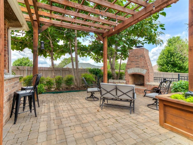 7821 Lindsay Ln, Edmond, OK 73025 - fenced backyard with an outdoor brick fireplace and a patio area