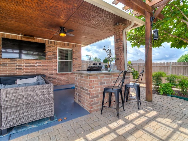 7821 Lindsay Ln, Edmond, OK 73025 - view of patio with an outdoor kitchen and a ceiling fan