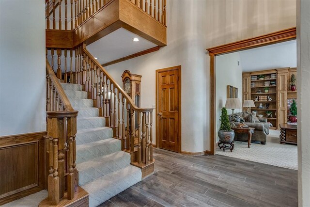 10116 Thompson Ave, Yukon, OK 73099 - staircase featuring a high ceiling and wood finished floors