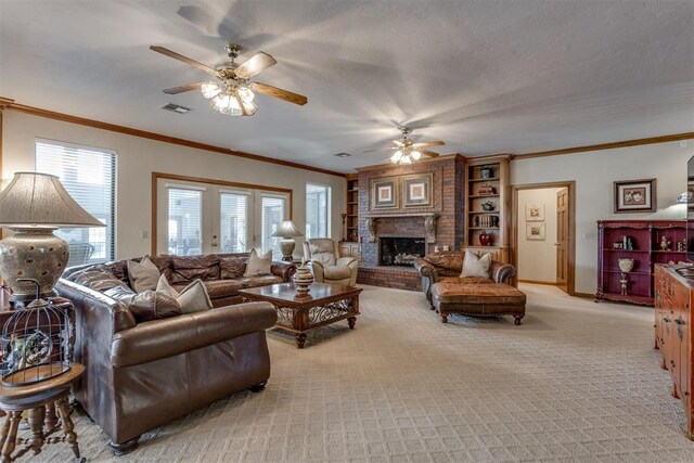 10116 Thompson Ave, Yukon, OK 73099 - living room featuring ceiling fan, a brick fireplace, crown molding, and light colored carpet