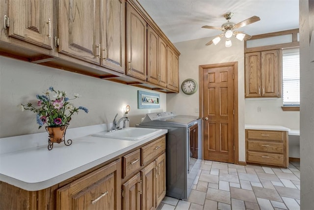 10116 Thompson Ave, Yukon, OK 73099 - laundry area featuring ceiling fan, cabinet space, independent washer and dryer, and stone finish floors