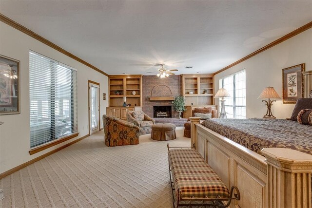 10116 Thompson Ave, Yukon, OK 73099 - bedroom with ornamental molding, light carpet, a brick fireplace, and a ceiling fan