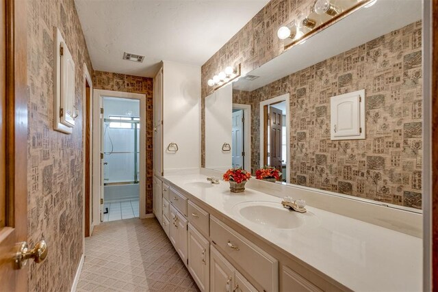 10116 Thompson Ave, Yukon, OK 73099 - full bath with double vanity and wallpapered walls