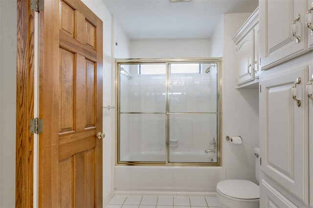 10116 Thompson Ave, Yukon, OK 73099 - bathroom featuring combined bath / shower with glass door and tile patterned floors