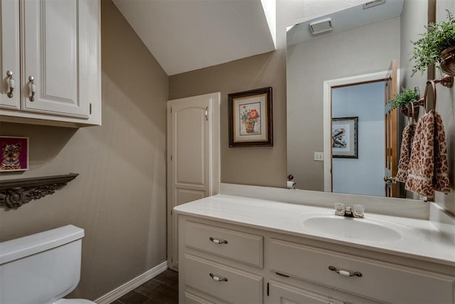 10116 Thompson Ave, Yukon, OK 73099 - half bath featuring vanity and wood finished floors