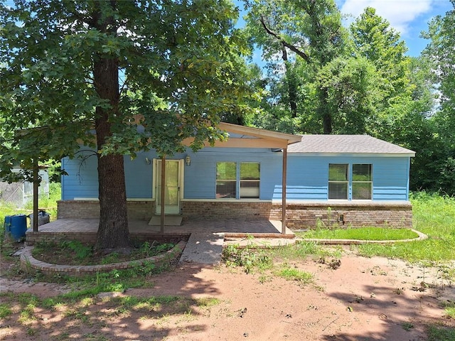 18451 Rolling Oak Rd, Newalla, OK 74857 - view of front of house featuring a porch and brick siding