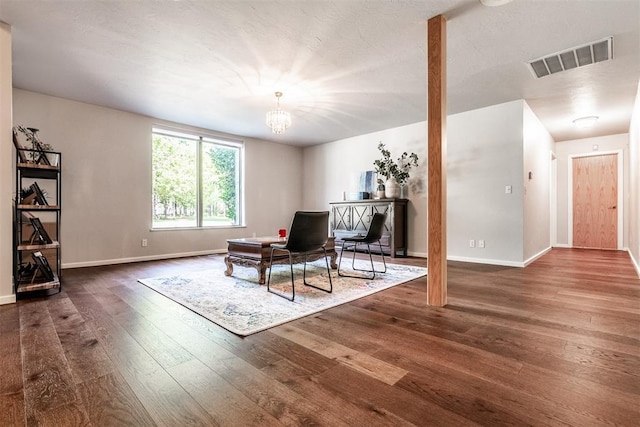6540 S Donna Ln, Oklahoma City, OK 73150 - sitting room with wood-type flooring and a chandelier