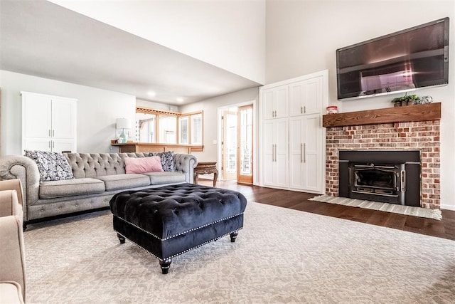6540 S Donna Ln, Oklahoma City, OK 73150 - living room featuring dark wood-style floors and a fireplace