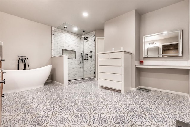 6540 S Donna Ln, Oklahoma City, OK 73150 - bathroom featuring a stall shower, a freestanding tub, and recessed lighting