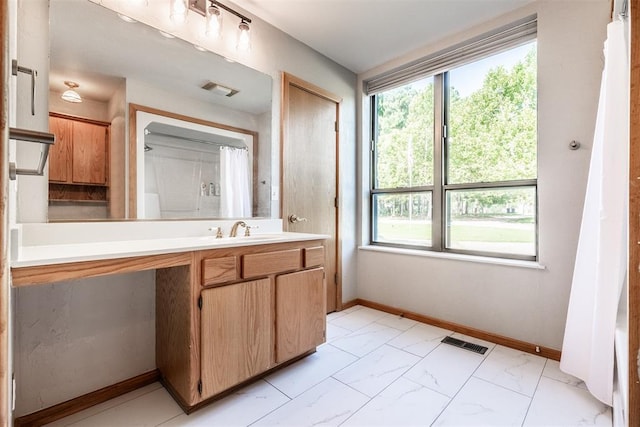 6540 S Donna Ln, Oklahoma City, OK 73150 - full bathroom featuring healthy amount of natural light, vanity, marble finish floors, and a shower with shower curtain