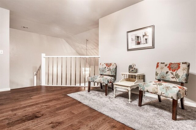 6540 S Donna Ln, Oklahoma City, OK 73150 - living area with wood finished floors, lofted ceiling, and an upstairs landing