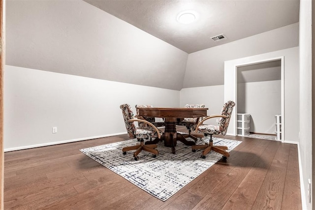 6540 S Donna Ln, Oklahoma City, OK 73150 - dining space featuring vaulted ceiling and hardwood / wood-style floors