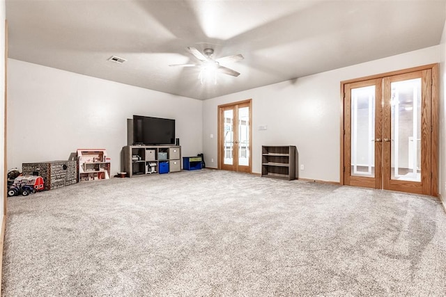 6540 S Donna Ln, Oklahoma City, OK 73150 - carpeted living room with french doors and a ceiling fan