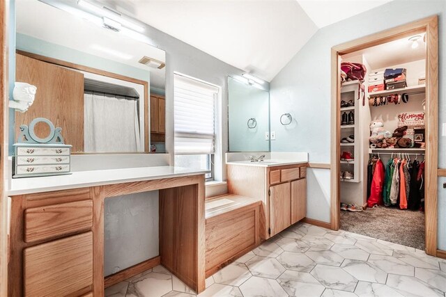6540 S Donna Ln, Oklahoma City, OK 73150 - full bathroom with vaulted ceiling, vanity, and a walk in closet