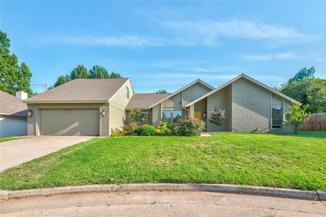 6348 Hyde Park Dr, Oklahoma City, OK 73162 - mid-century modern home with a garage, concrete driveway, and brick siding