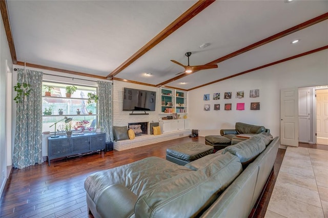 6348 Hyde Park Dr, Oklahoma City, OK 73162 - living area featuring a ceiling fan, wood finished floors, and a fireplace