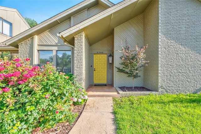 6348 Hyde Park Dr, Oklahoma City, OK 73162 - property entrance featuring brick siding and board and batten siding