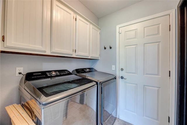 6348 Hyde Park Dr, Oklahoma City, OK 73162 - washroom featuring washing machine and clothes dryer and cabinet space