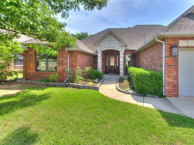 17104 Wales Green Ave, Edmond, OK 73012 - view of front facade with roof with shingles, brick siding, an attached garage, a front yard, and stone siding