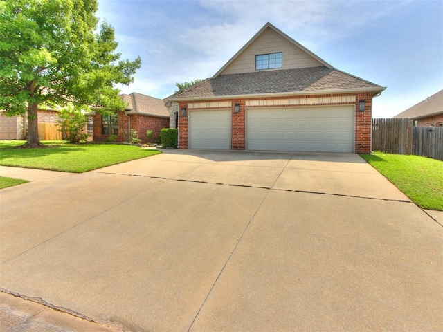 17104 Wales Green Ave, Edmond, OK 73012 - traditional home featuring brick siding, a shingled roof, concrete driveway, and an attached garage