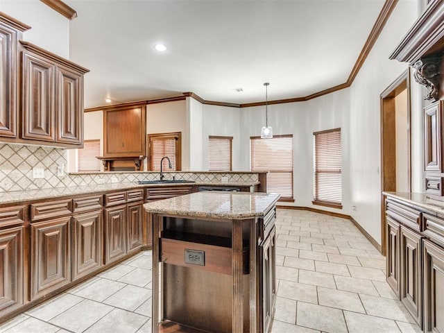 17104 Wales Green Ave, Edmond, OK 73012 - kitchen featuring light tile patterned flooring, decorative backsplash, a peninsula, light stone countertops, and crown molding