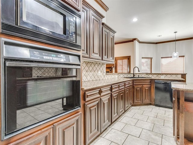 17104 Wales Green Ave, Edmond, OK 73012 - kitchen featuring black appliances, tasteful backsplash, a peninsula, light tile patterned floors, and crown molding