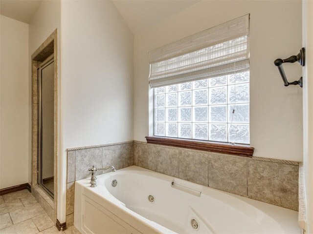 17104 Wales Green Ave, Edmond, OK 73012 - full bathroom with a jetted tub, a shower stall, and vaulted ceiling