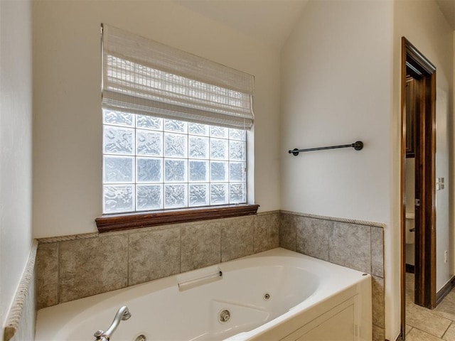17104 Wales Green Ave, Edmond, OK 73012 - bathroom with a tub with jets