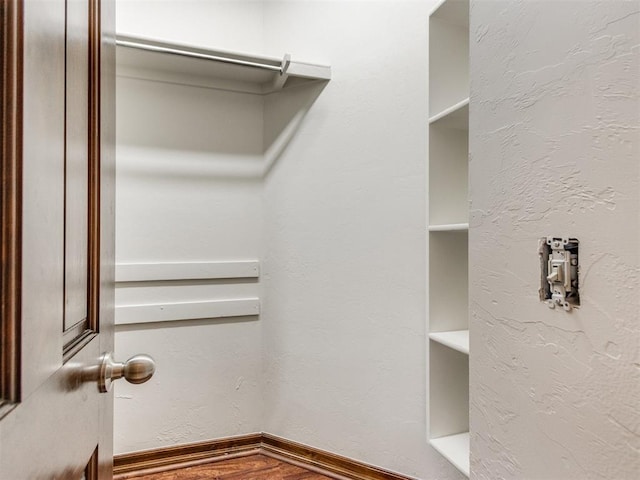 17104 Wales Green Ave, Edmond, OK 73012 - walk in closet with wood finished floors