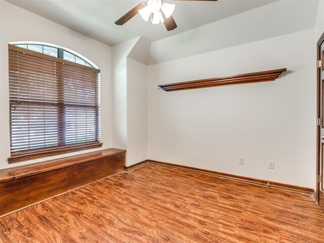 17104 Wales Green Ave, Edmond, OK 73012 - empty room with ceiling fan and wood finished floors