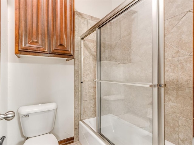 17104 Wales Green Ave, Edmond, OK 73012 - bathroom with toilet and combined bath / shower with glass door