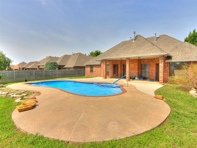 17104 Wales Green Ave, Edmond, OK 73012 - view of swimming pool with a patio, a fenced backyard, and a pool with connected hot tub