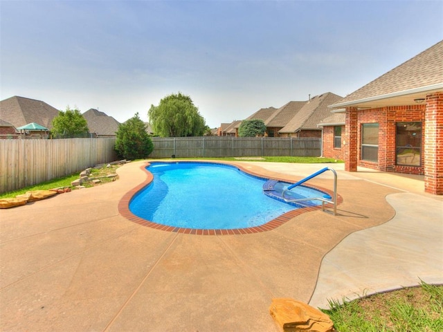 17104 Wales Green Ave, Edmond, OK 73012 - view of swimming pool featuring a patio and a fenced backyard