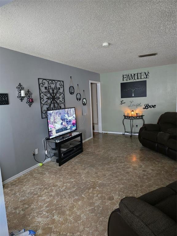 618 Briarwood Ln, Frederick, OK 73542 - living room with a textured ceiling and baseboards