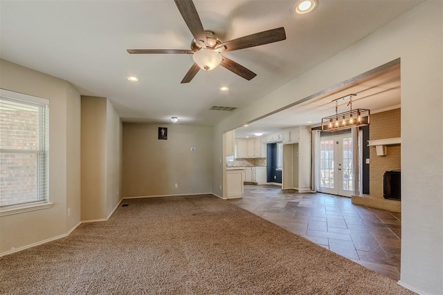 5717 NW 31st Ter, Oklahoma City, OK 73122 - unfurnished living room with ceiling fan, recessed lighting, french doors, and dark carpet