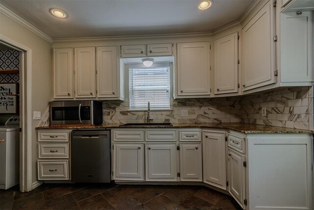 5717 NW 31st Ter, Oklahoma City, OK 73122 - kitchen featuring dishwasher, stainless steel microwave, washer / dryer, tasteful backsplash, and recessed lighting