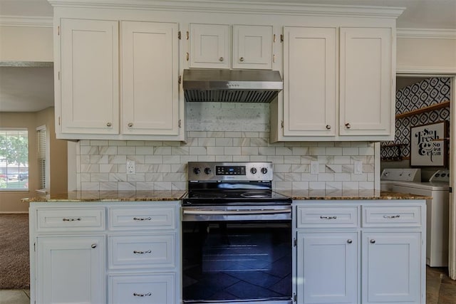 5717 NW 31st Ter, Oklahoma City, OK 73122 - kitchen featuring electric range, under cabinet range hood, independent washer and dryer, dark stone countertops, and crown molding