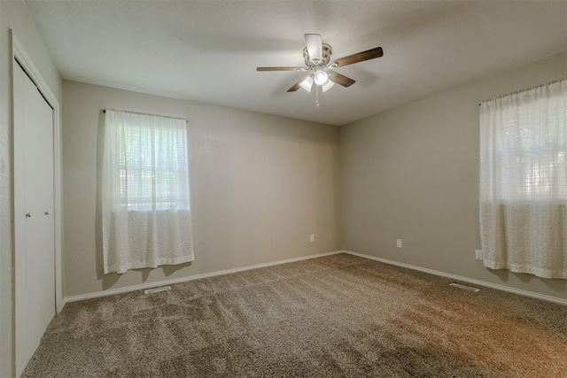 5717 NW 31st Ter, Oklahoma City, OK 73122 - unfurnished bedroom with carpet, a closet, and ceiling fan