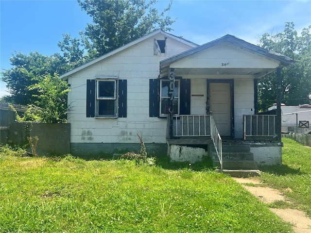 307 W Walnut Ave, Seminole, OK 74868 - bungalow featuring a porch