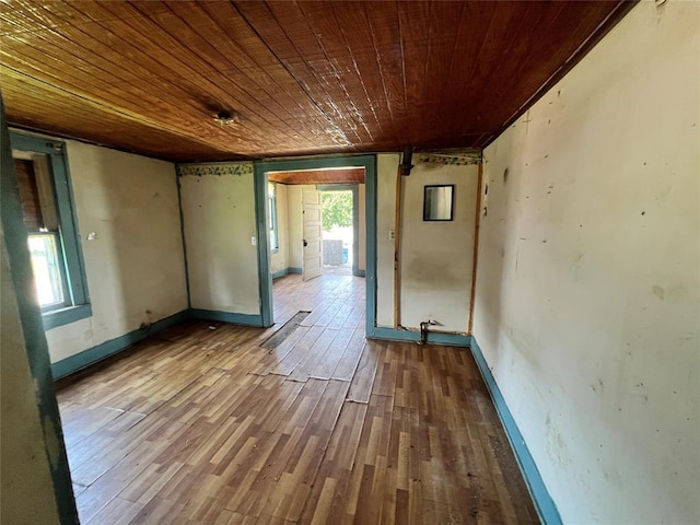 307 W Walnut Ave, Seminole, OK 74868 - spare room featuring wood ceiling and wood finished floors