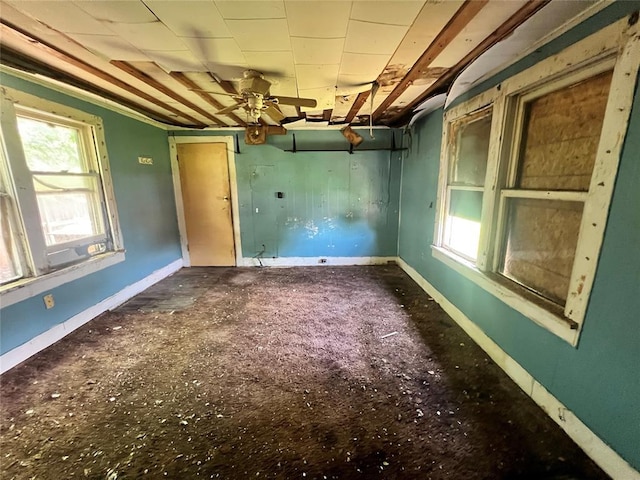 307 W Walnut Ave, Seminole, OK 74868 - unfurnished room with a ceiling fan and baseboards