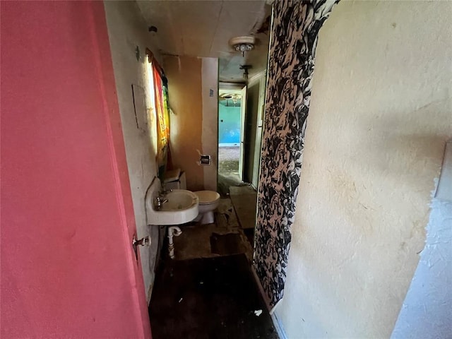 307 W Walnut Ave, Seminole, OK 74868 - bathroom with toilet and a sink