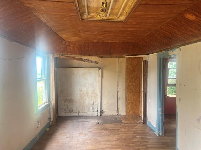 307 W Walnut Ave, Seminole, OK 74868 - spare room featuring plenty of natural light, wood finished floors, lofted ceiling, and wooden ceiling