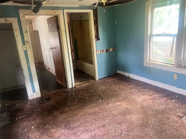 307 W Walnut Ave, Seminole, OK 74868 - unfurnished bedroom featuring baseboards